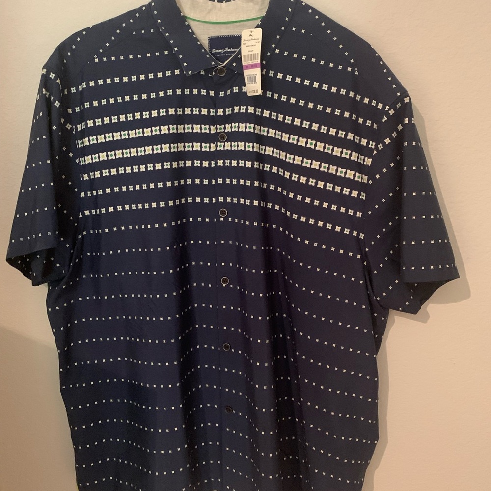 New Tommy Bahama men’s camp shirt. XXL gorgeous! Was a gift but didn’t fit.